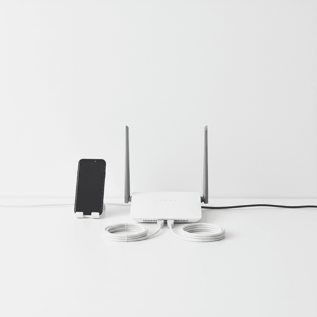 Networking router and cables on a bright desk